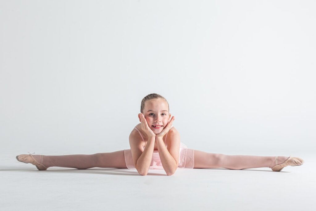 Young ballerina in splits position