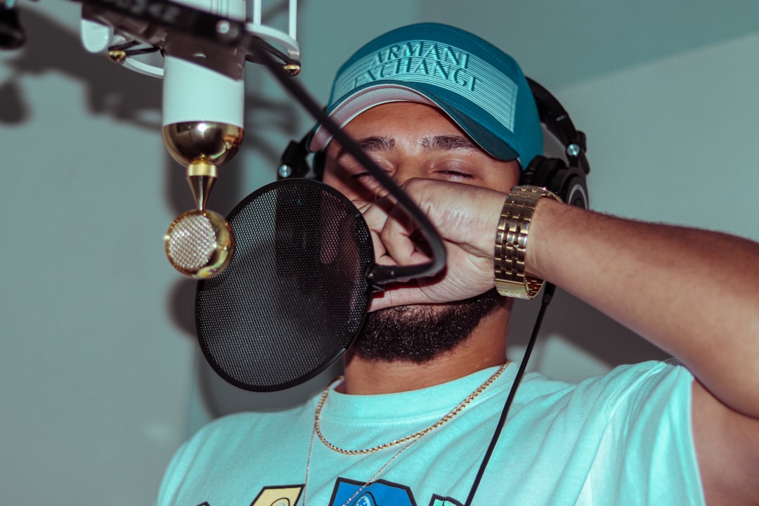 Rapper in the studio making a new song for his album. This is a typical night for a hip-hop artist, living the lifestyle and trying to achieve his dreams.