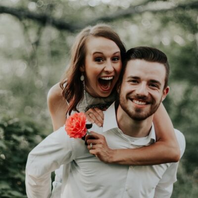 We were walking through a park with trails leading into the forests, when we saw this breathtaking coral flower… my sister ran and got it and jumped on her husbands back… right then and there is where is captured this priceless image.
