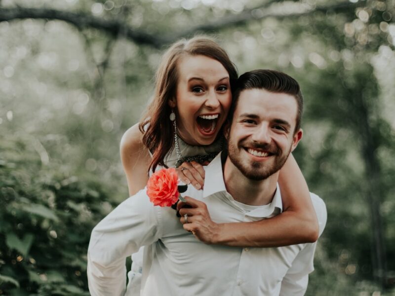 We were walking through a park with trails leading into the forests, when we saw this breathtaking coral flower… my sister ran and got it and jumped on her husbands back… right then and there is where is captured this priceless image.