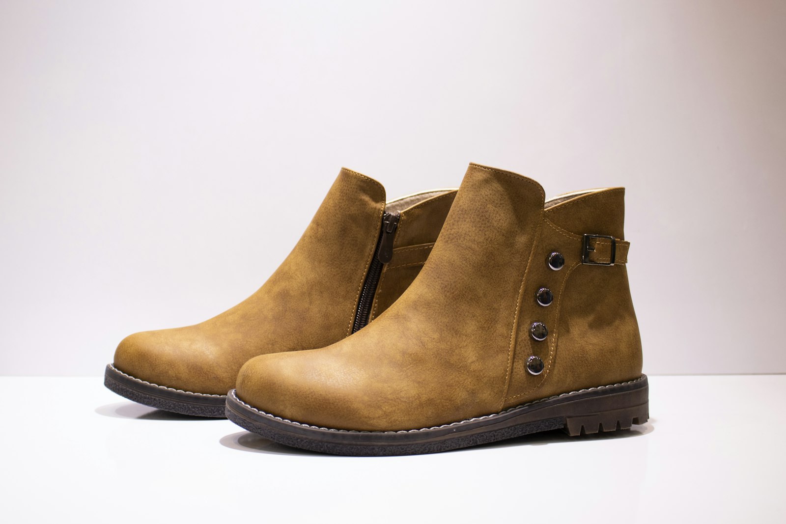 a close up of a pair of brown boots